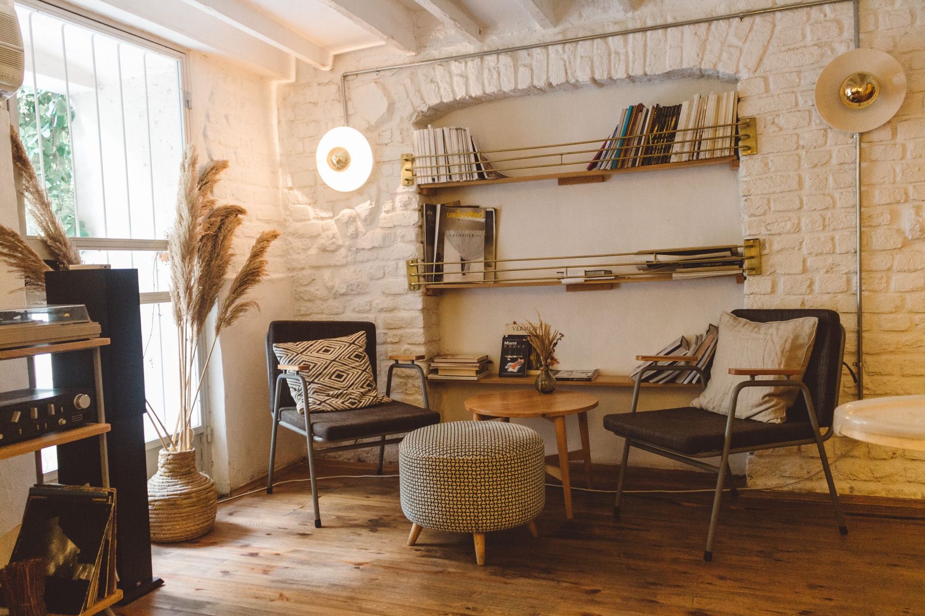 A light, considered sitting room — layered textiles, a deep arched alcove and tall windows, the kind of scheme Katherine Bedson designs for period homes